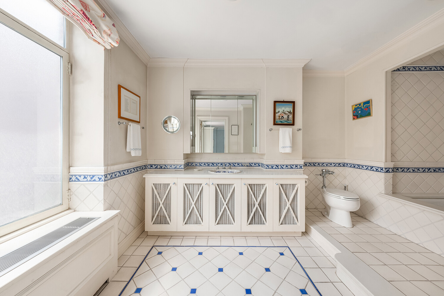 4 Sutton Place, Unit DUPLEX6/7 Manhattan, NY 10022 - Photo 17 of 19 a bathroom with a granite countertop sink and a mirror