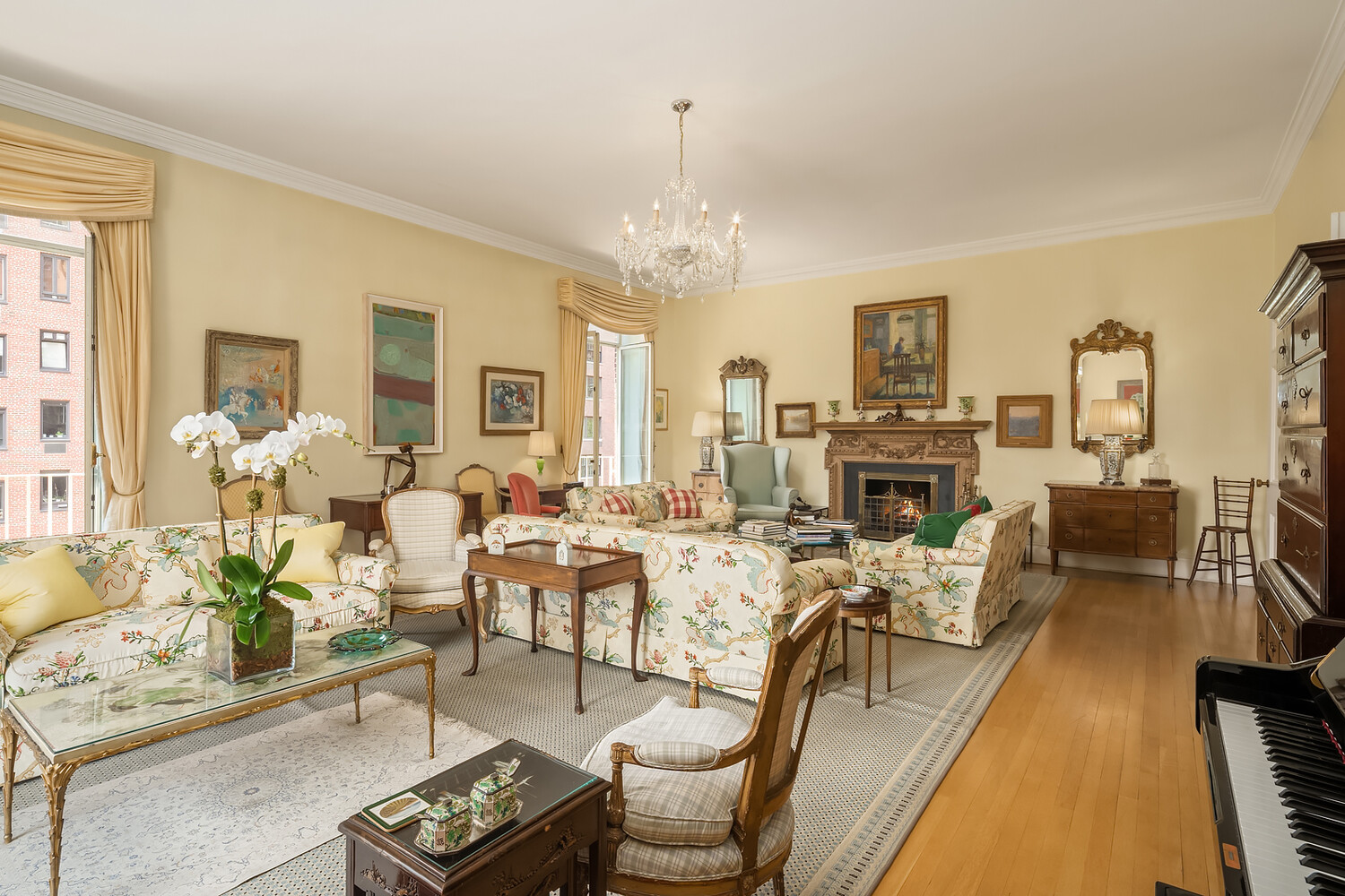 4 Sutton Place, Unit DUPLEX6/7 Manhattan, NY 10022 - Photo 5 of 19 a living room with fireplace furniture and a chandelier