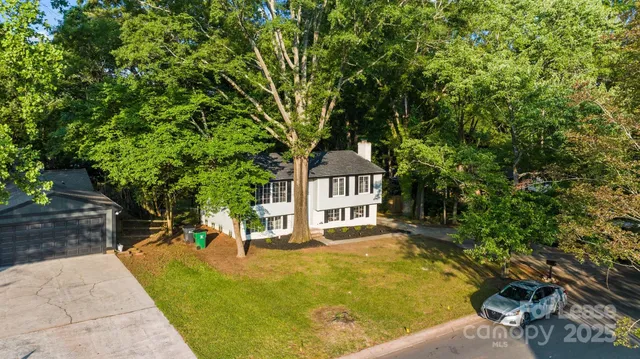 a view of a house with swimming pool