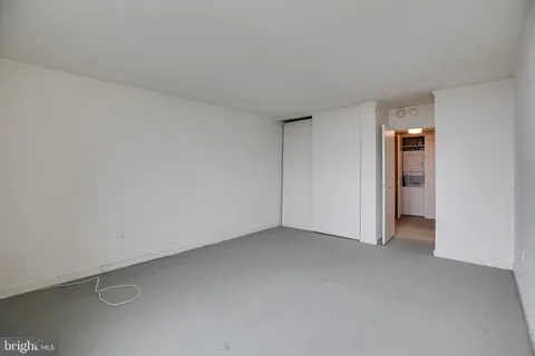 a view of an empty room and a window