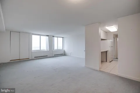 a view of empty room with windows