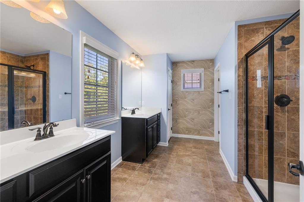 207 Gabriel Drive Mars, PA 16046 - Photo 21 of 47 a spacious bathroom with a double vanity sink a mirror and a shower