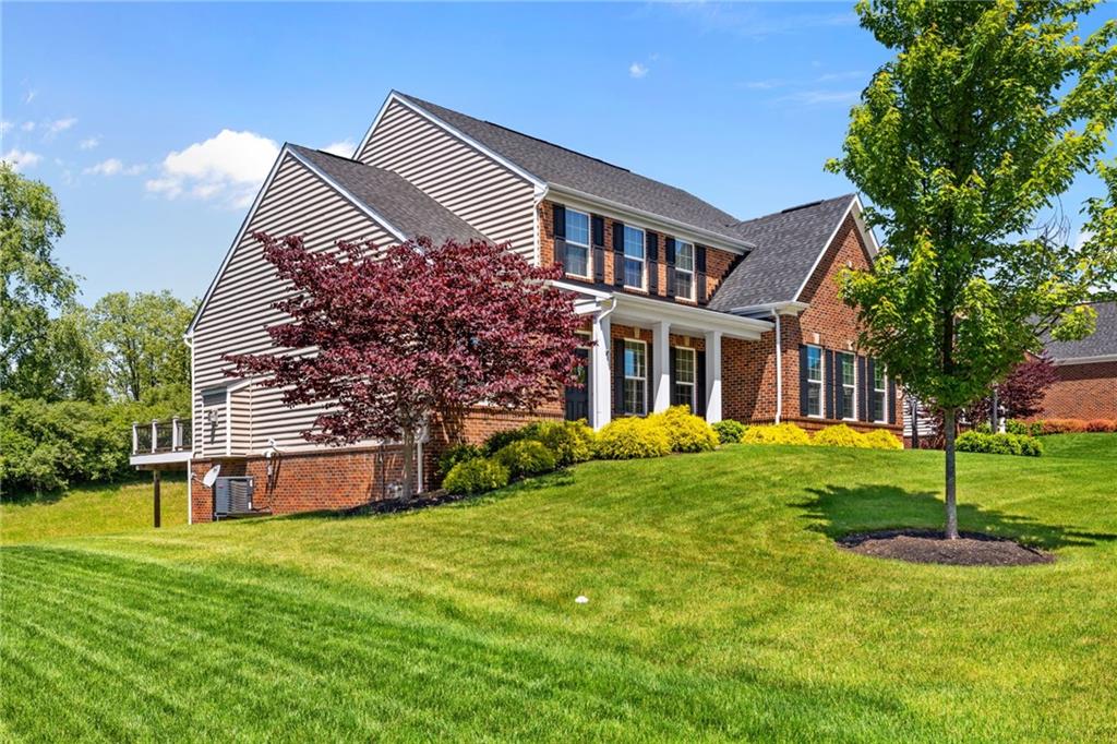 207 Gabriel Drive Mars, PA 16046 - Photo 42 of 47 a front view of a house with a yard and trees