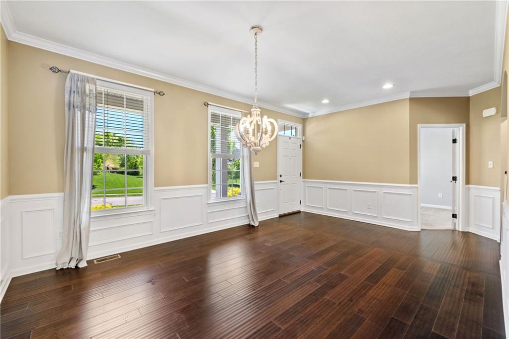 207 Gabriel Drive Mars, PA 16046 - Photo 6 of 47 a view of an empty room with wooden floor and a window
