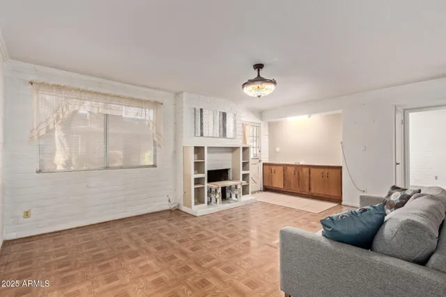 a living room with furniture and a window