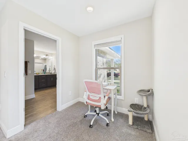 a living room with furniture and a chair