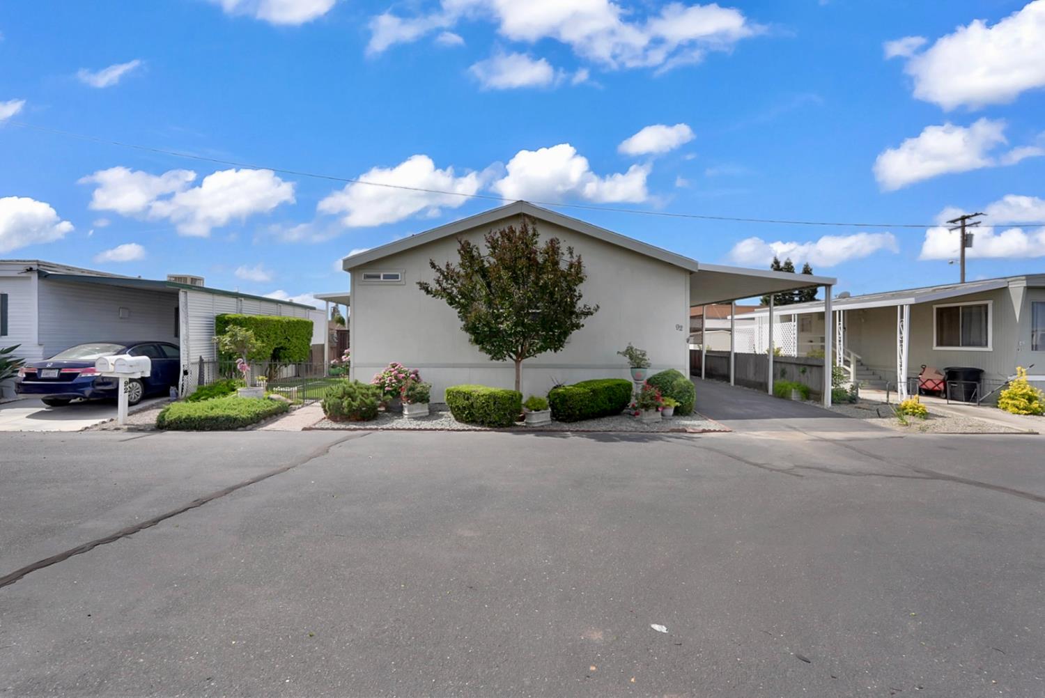1459 Standiford, Unit 92 Modesto, CA 95350 - Photo 2 of 19 a view of a house with a street