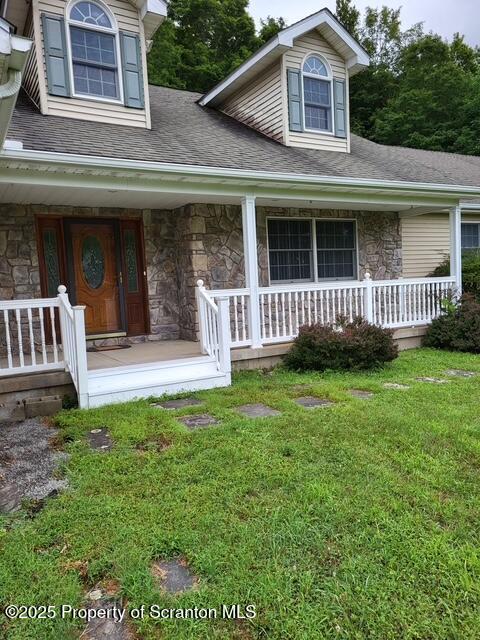 260 Johnson Hl Road Carbondale, PA 18407 - Photo 41 of 48 a view of a house with a yard and deck