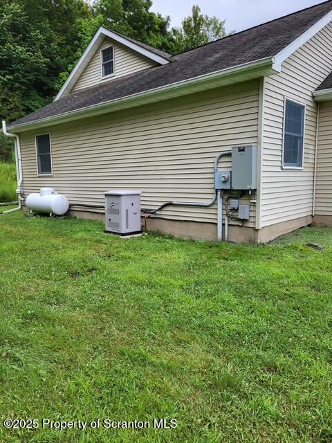 260 Johnson Hl Road Carbondale, PA 18407 - Photo 43 of 48 a front view of a house with a yard and garage