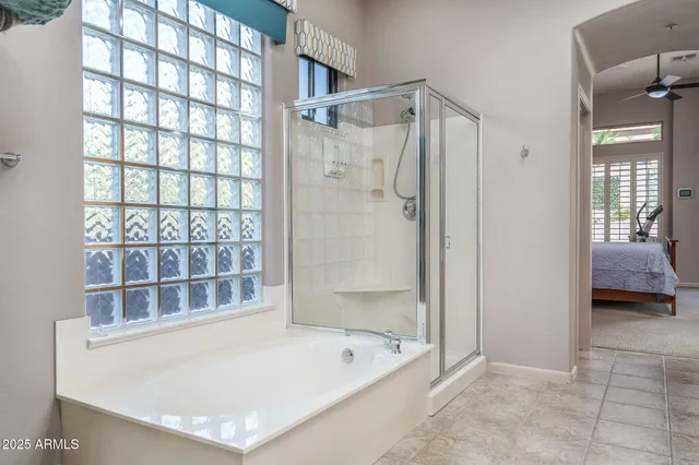 a bedroom with furniture and a window