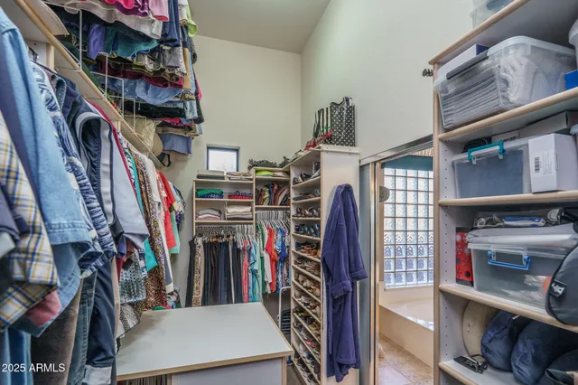 a bathroom with a tub a sink and a shower
