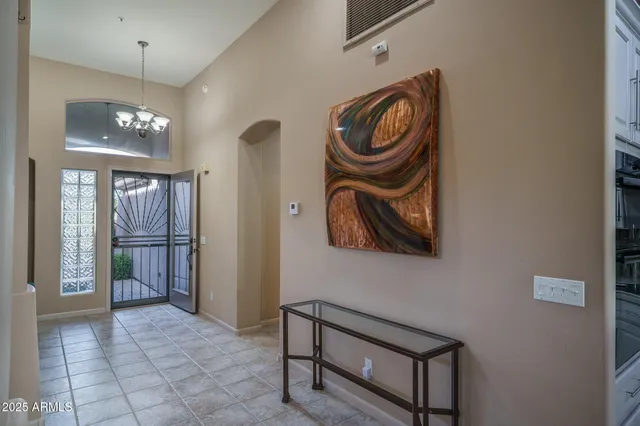 a view of walk in closet with clothes
