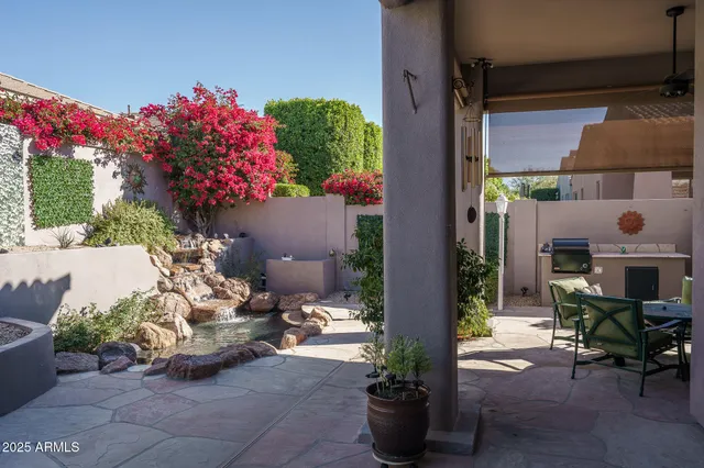 a front view of a house with sitting area