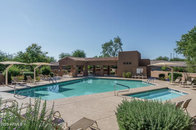a view of backyard with seating area and green space