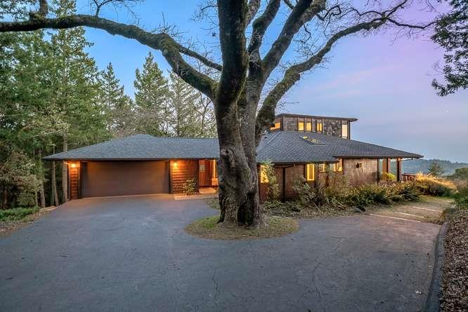 22154 Miller Ridge Road Los Gatos, CA 95033 - Photo 1 of 19 a front view of a house with a yard