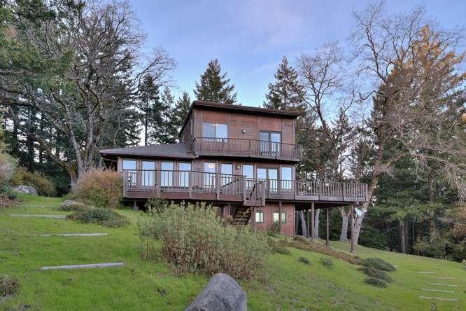 22154 Miller Ridge Road Los Gatos, CA 95033 - Photo 16 of 19 a view of a wooden house with a big yard and large trees