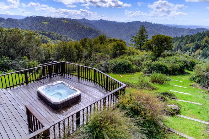 22154 Miller Ridge Road Los Gatos, CA 95033 - Photo 17 of 19 a view of a roof deck with wooden floor and a mountain view