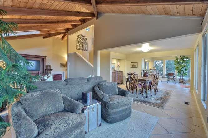 22154 Miller Ridge Road Los Gatos, CA 95033 - Photo 3 of 19 a living room with furniture and a large window