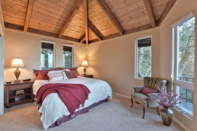 22154 Miller Ridge Road Los Gatos, CA 95033 - Photo 7 of 19 a bedroom with a bed and window