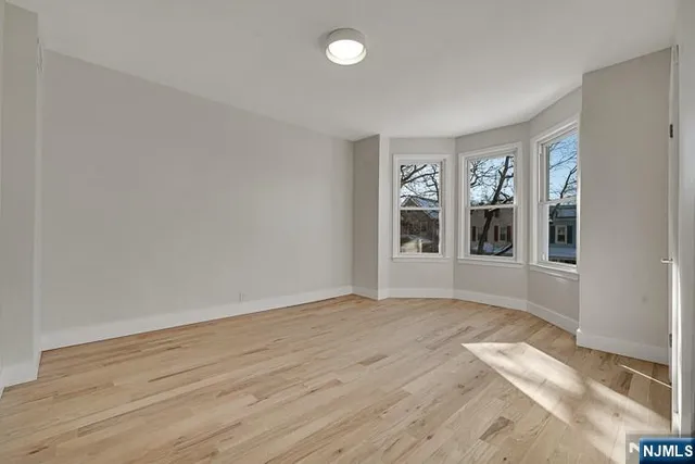 a kitchen with granite countertop a stove top oven sink and cabinets