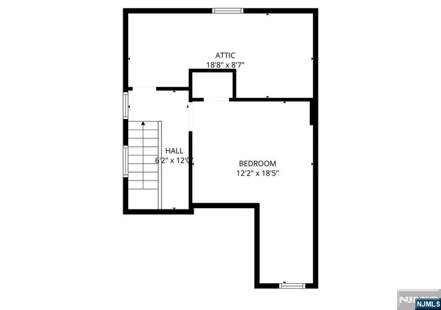 a living room with furniture and baby crib