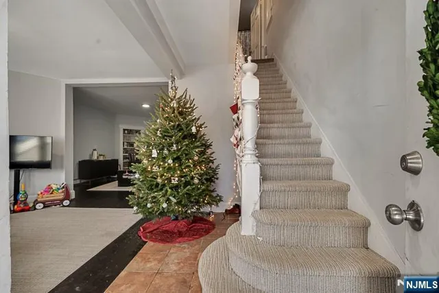 a view of a workspace with furniture and gym equipment