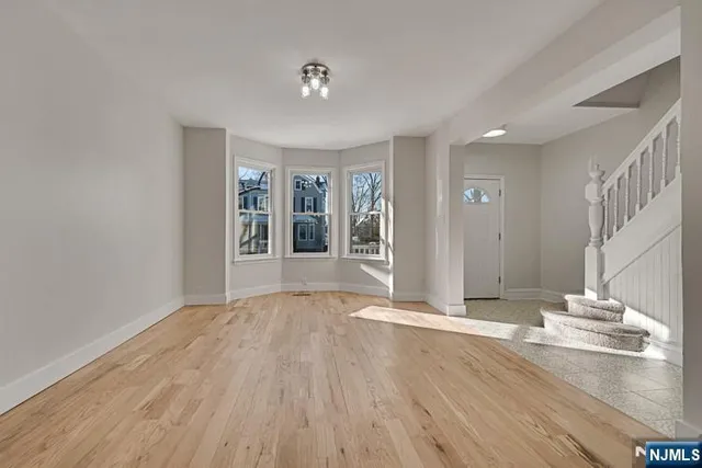 a bathroom with a shower a toilet and a sink