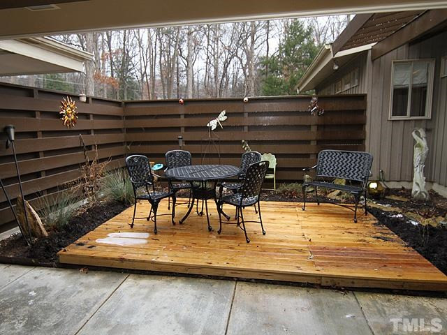 4901 Rembert Drive Raleigh, NC 27612 - Photo 23 of 25 The courtyard is located on the front of the home and it connects the carport and the house. It has a nice landscape border and is gated. There are also 2 storage rooms as well. Great space for entertaining or even a garden. Courtyard