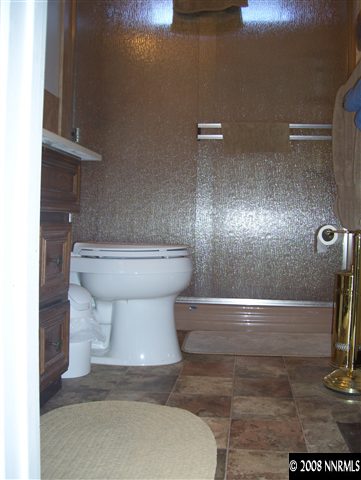11590 Osage Road Reno, NV 89508 - Photo 3 of 9 a bathroom with a toilet and a shower