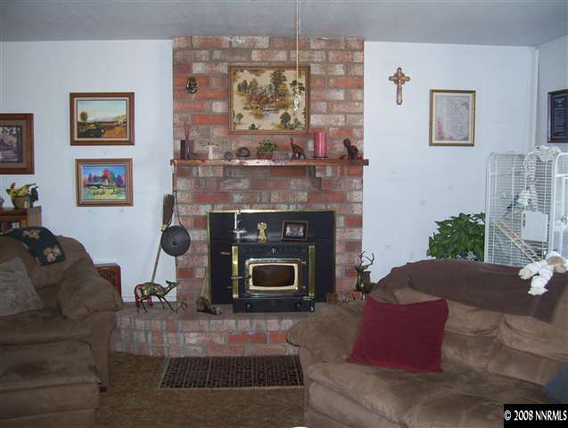 11590 Osage Road Reno, NV 89508 - Photo 5 of 9 a living room with furniture and a fireplace