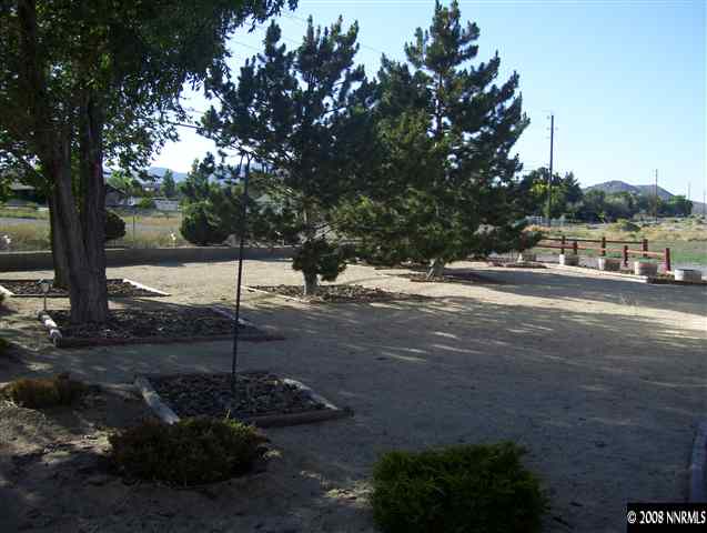 11590 Osage Road Reno, NV 89508 - Photo 8 of 9 a backyard of a house with lots of green space