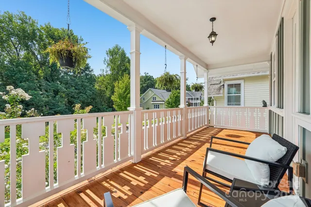 a view of walk in closet with clothes