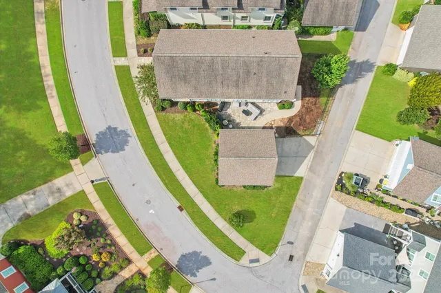 an aerial view of a house with a lake view