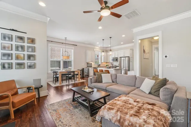 an aerial view of a houses with a yard