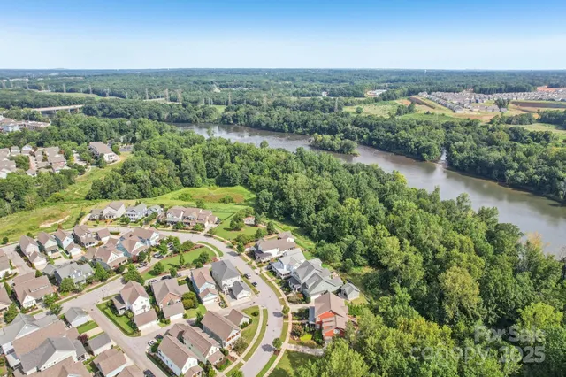 a view of hallway with stairs and wooden floor