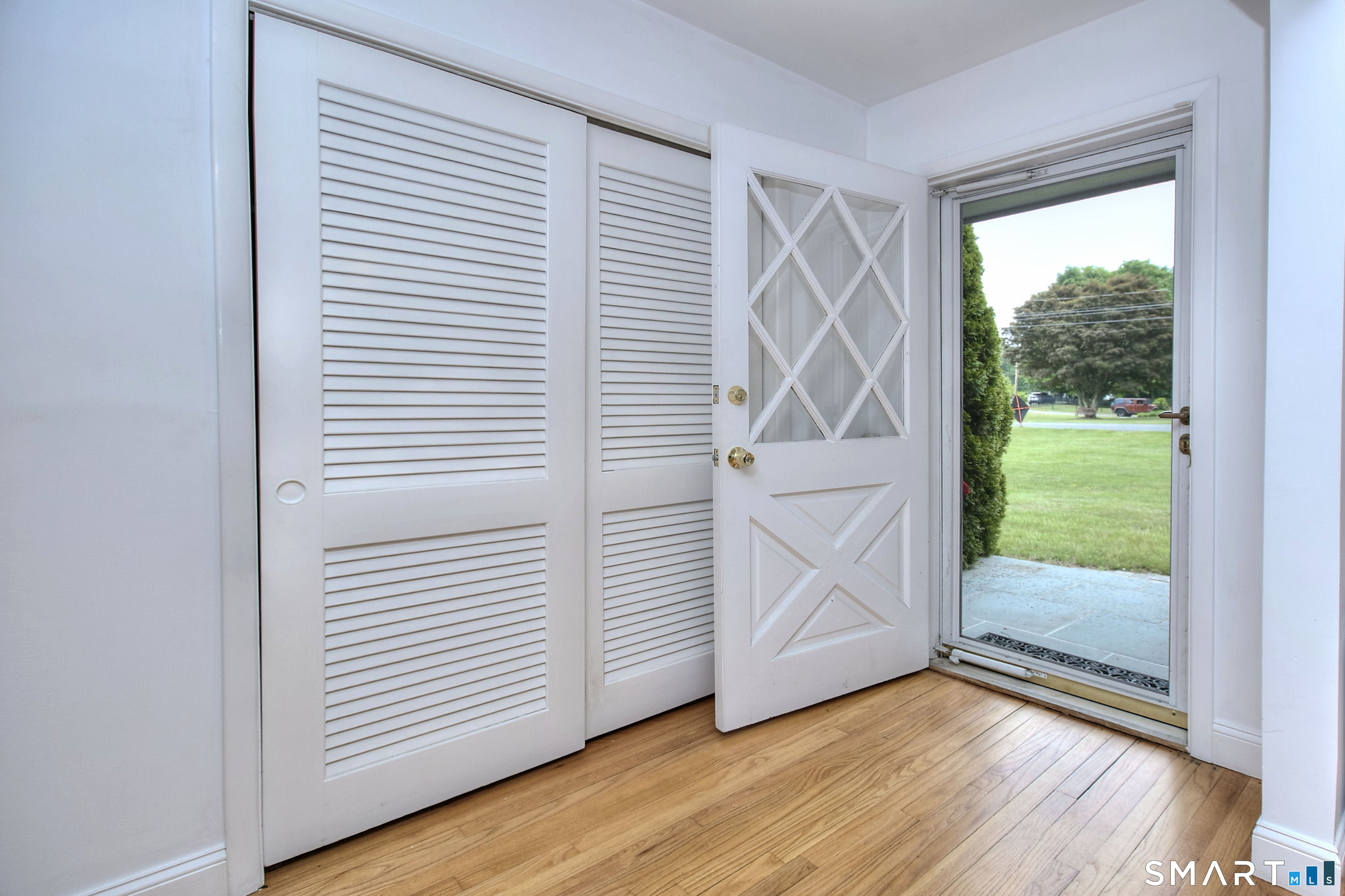 324 Ridge Road Orange, CT 06477 - Photo 2 of 38 a view of an entryway with wooden floor
