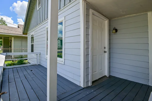 a view of front door deck and patio