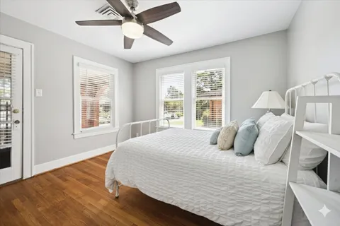 a bedroom with a bed and window