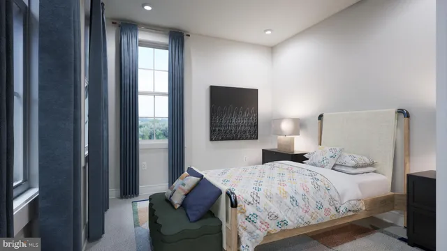 a bedroom with a bed and a couch