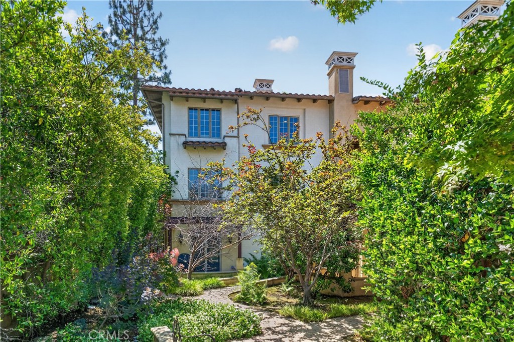 2454 Oswego Street, Unit 301 Pasadena, CA 91107 - Photo 1 of 59 a view of a house with a yard and plants