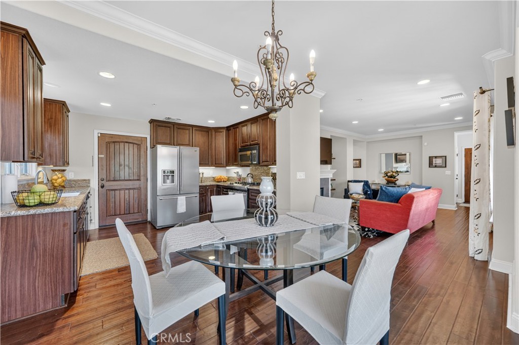 2454 Oswego Street, Unit 301 Pasadena, CA 91107 - Photo 11 of 59 a view of a dining room with furniture and wooden floor