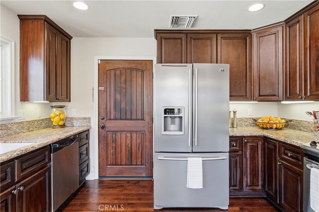 2454 Oswego Street, Unit 301 Pasadena, CA 91107 - Photo 18 of 59 a kitchen with stainless steel appliances granite countertop a refrigerator and a stove top oven