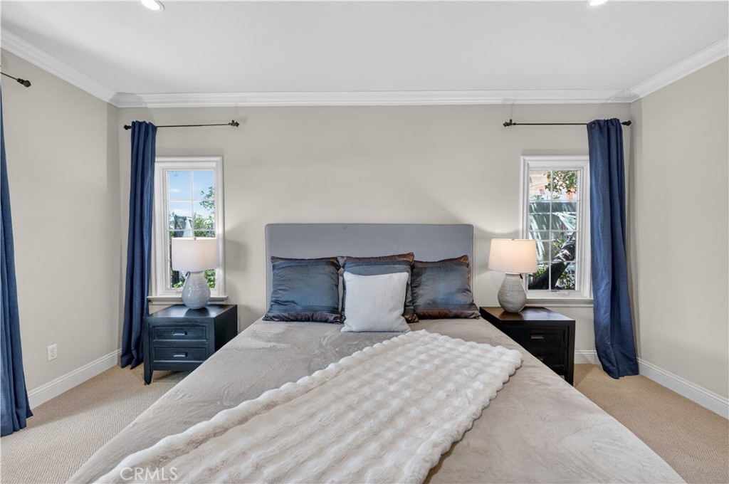2454 Oswego Street, Unit 301 Pasadena, CA 91107 - Photo 23 of 59 a bedroom with a bed and wooden floor