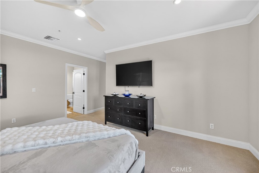 2454 Oswego Street, Unit 301 Pasadena, CA 91107 - Photo 25 of 59 a bedroom with a bed and a flat tv screen on dresser