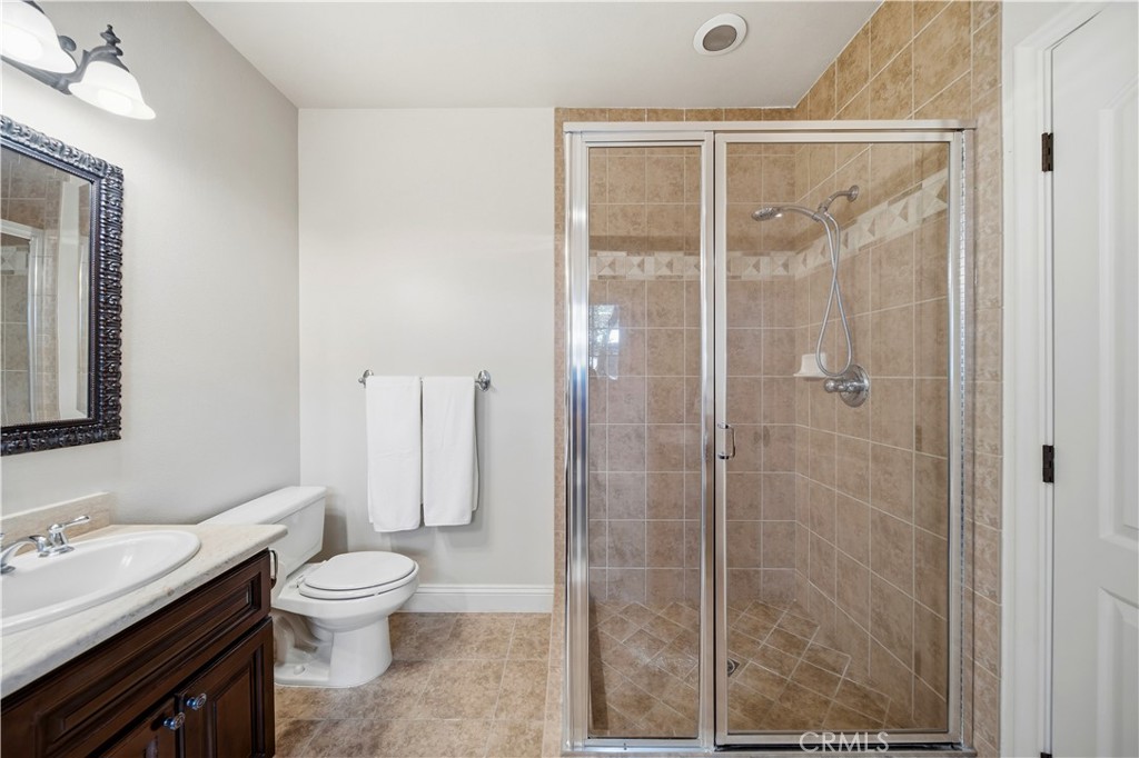 2454 Oswego Street, Unit 301 Pasadena, CA 91107 - Photo 29 of 59 a white toilet sitting next to a bathroom sink
