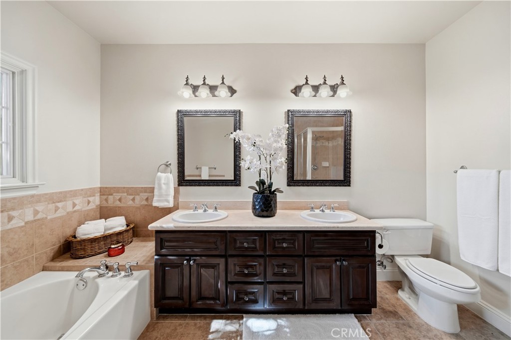 2454 Oswego Street, Unit 301 Pasadena, CA 91107 - Photo 31 of 59 a bathroom with a sink vanity and a toilet
