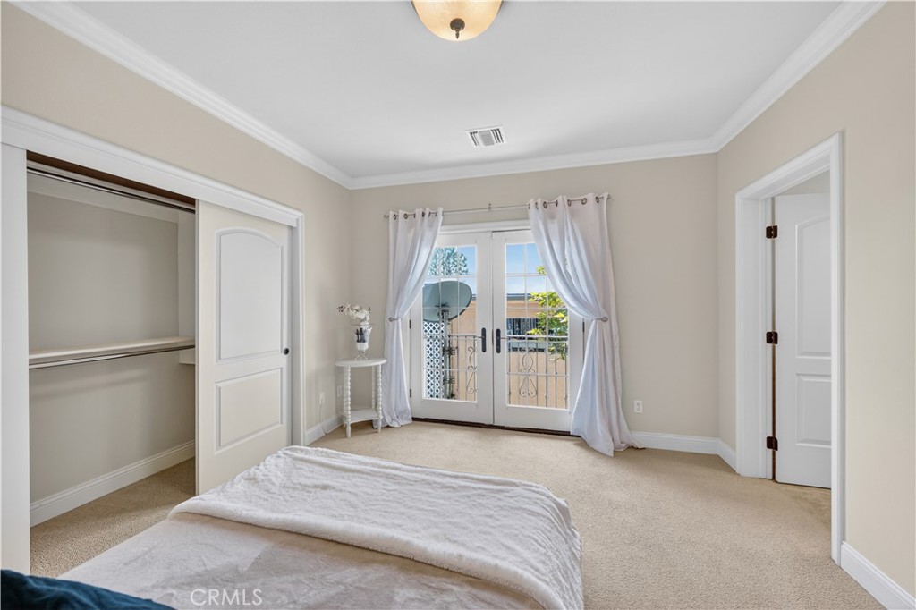 2454 Oswego Street, Unit 301 Pasadena, CA 91107 - Photo 36 of 59 a bedroom with a bed and a large window
