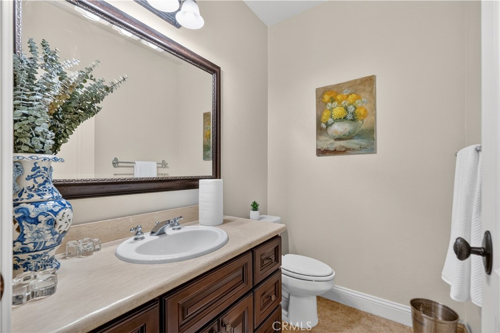 2454 Oswego Street, Unit 301 Pasadena, CA 91107 - Photo 43 of 59 a bathroom with a toilet a sink and mirror
