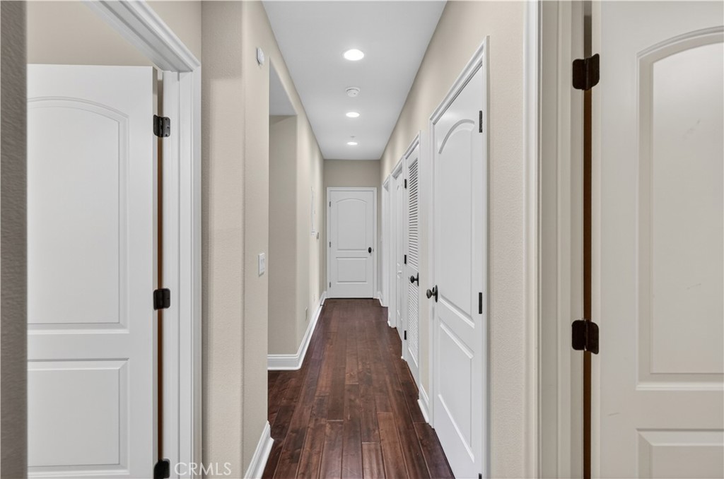 2454 Oswego Street, Unit 301 Pasadena, CA 91107 - Photo 45 of 59 a view of a hallway with wooden floor and staircase