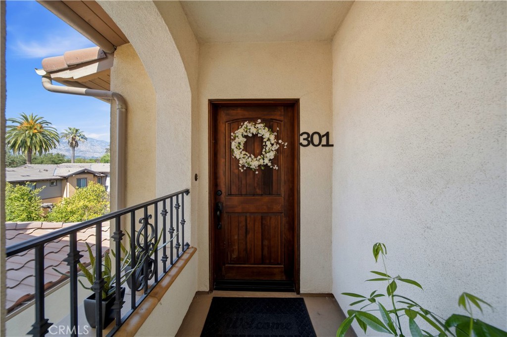 2454 Oswego Street, Unit 301 Pasadena, CA 91107 - Photo 49 of 59 a view of a hallway with wooden floor and a potted plant